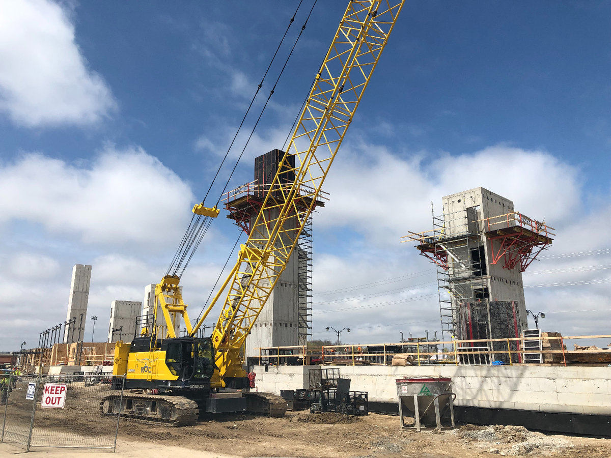 a yellow crane at a construction site